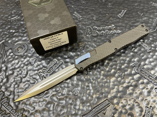 Pre-Owned Heretic Knives Cleric II - Black ANO Chassis w/ Carbon Fiber inlay, Carbon Fiber Top Cover, Stonewashed Double Edge Magnacut blade, Blue Ti Button and Blue Ti Clip  POH020-2A-CF/BLU