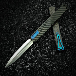 Heretic Knives Cleric II - Black ANO Chassis w/ Carbon Fiber inlay, Carbon Fiber Top Cover, Stonewashed Double Edge Magnacut blade, Blue Ti Button and Blue Ti Clip  H020-2A-CF/BLU