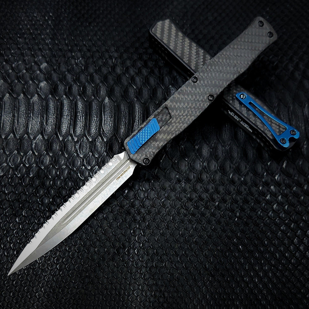 Heretic Knives Cleric II - Black ANO Chassis w/ Carbon Fiber inlay, Carbon Fiber Top Cover, Stonewashed Double Edge FULL SERRATED Magnacut blade, Blue Ti Button and Blue Ti Clip  H020-2C-CF/BLU