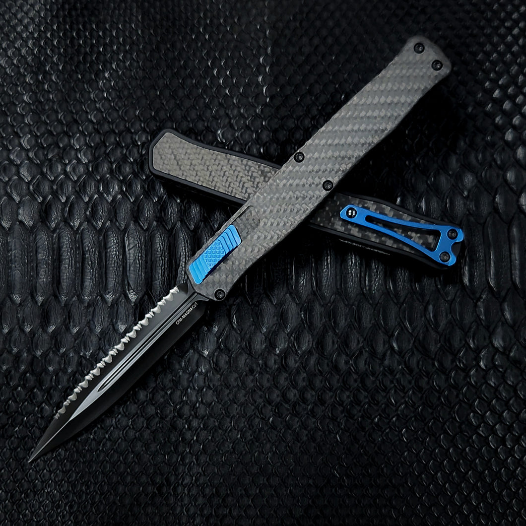 Heretic Knives Cleric II - Black ANO Chassis w/ Carbon Fiber inlay, Carbon Fiber Top Cover, DLC Double Edge FULL SERRATED Magnacut blade, Blue Ti Button and Blue Ti Clip  H020-6C-CF/BLU