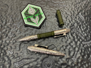 Heretic Thoth Tactical Pen SW Titanium cap and tail, Green ANO aluminum barrel, BW Ti bolt, and SW Ti clip  H038-GRN